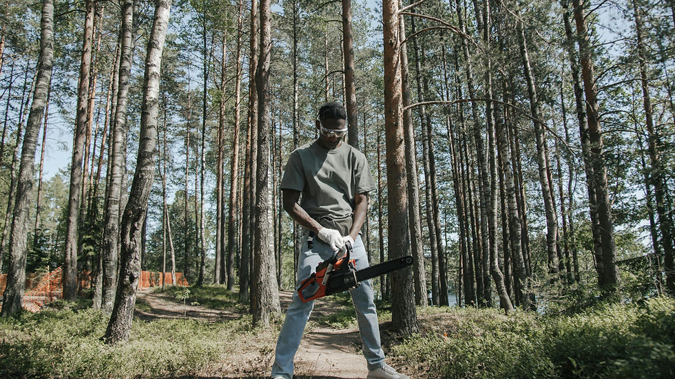 Person wearing eye protection while using a chainsaw