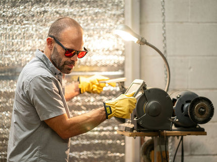 person wearing eye protecting while operating heavy machinery