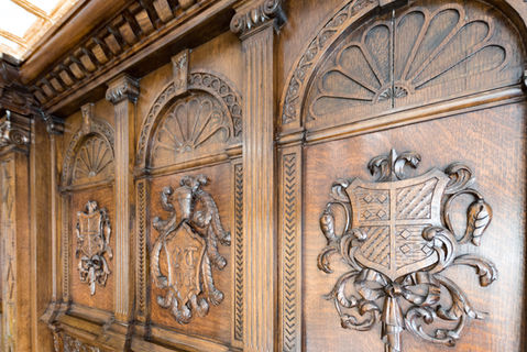 Detail of coffered ceiling and carved wood paneling in 80 Eighth Avenue conference room.