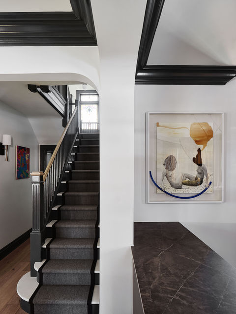 Restored 1904 Victorian home in Fiske Terrace Brooklyn original wood railing and stairs and stained glass window.