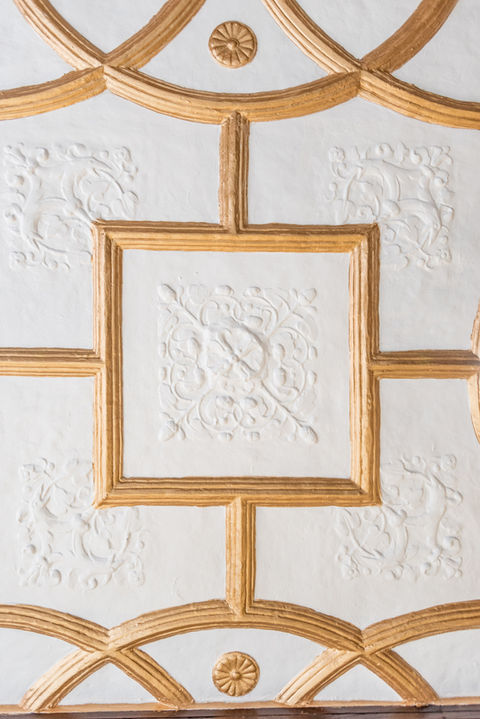 Detail of coffered ceiling and carved wood paneling in 80 Eighth Avenue conference room.