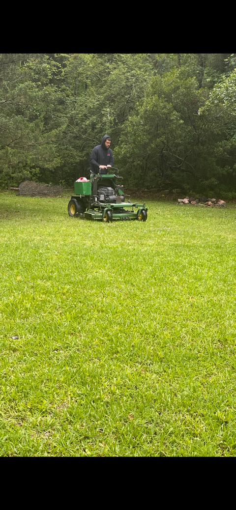 Storm damage yard cleanup with debris removal by Jacksonville NC
