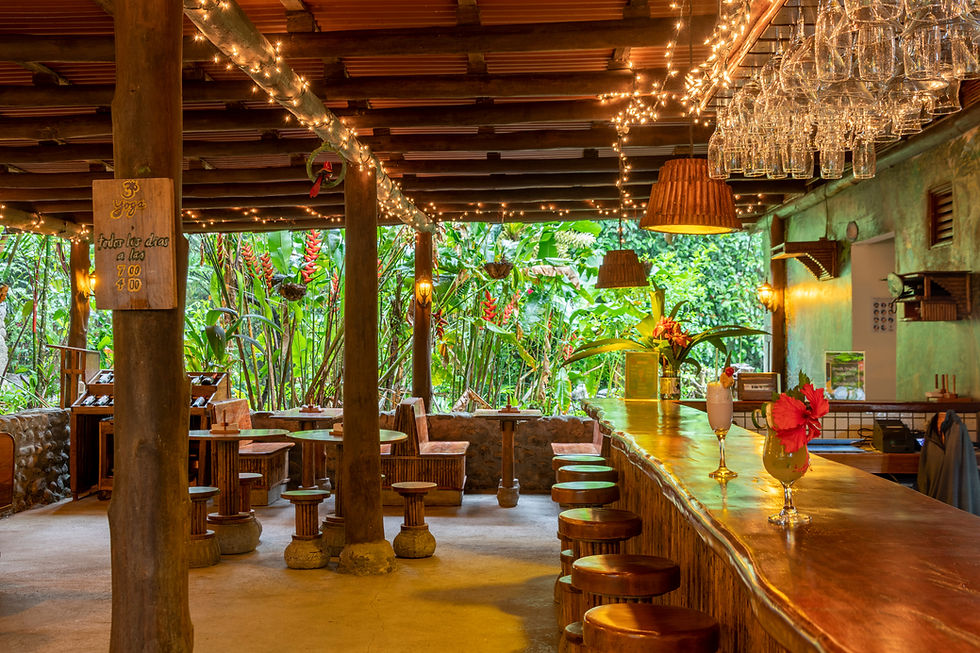 Communal dining space with wooden tables at therapist training retreat in Costa Rica
