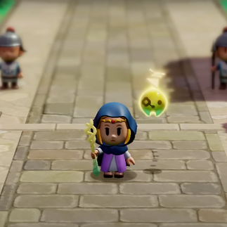 Zelda avec une capuche et Tri à ses côtés dans Echoes of Wisdom