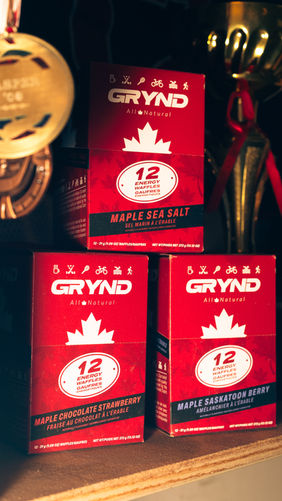 Grynd product boxes sitting in trophy case