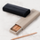 Thumbnail: et Must – Rabitti 1969 ETNA leather pencil cases in taupe and black, elegant sliding box design perfect for stylish storage.