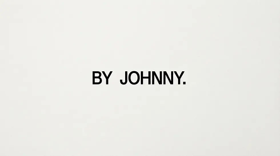 Graphic text featuring the words BY JOHNNY. centered on a light-colored background.