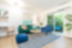 A bright living room with cozy couches and chairs