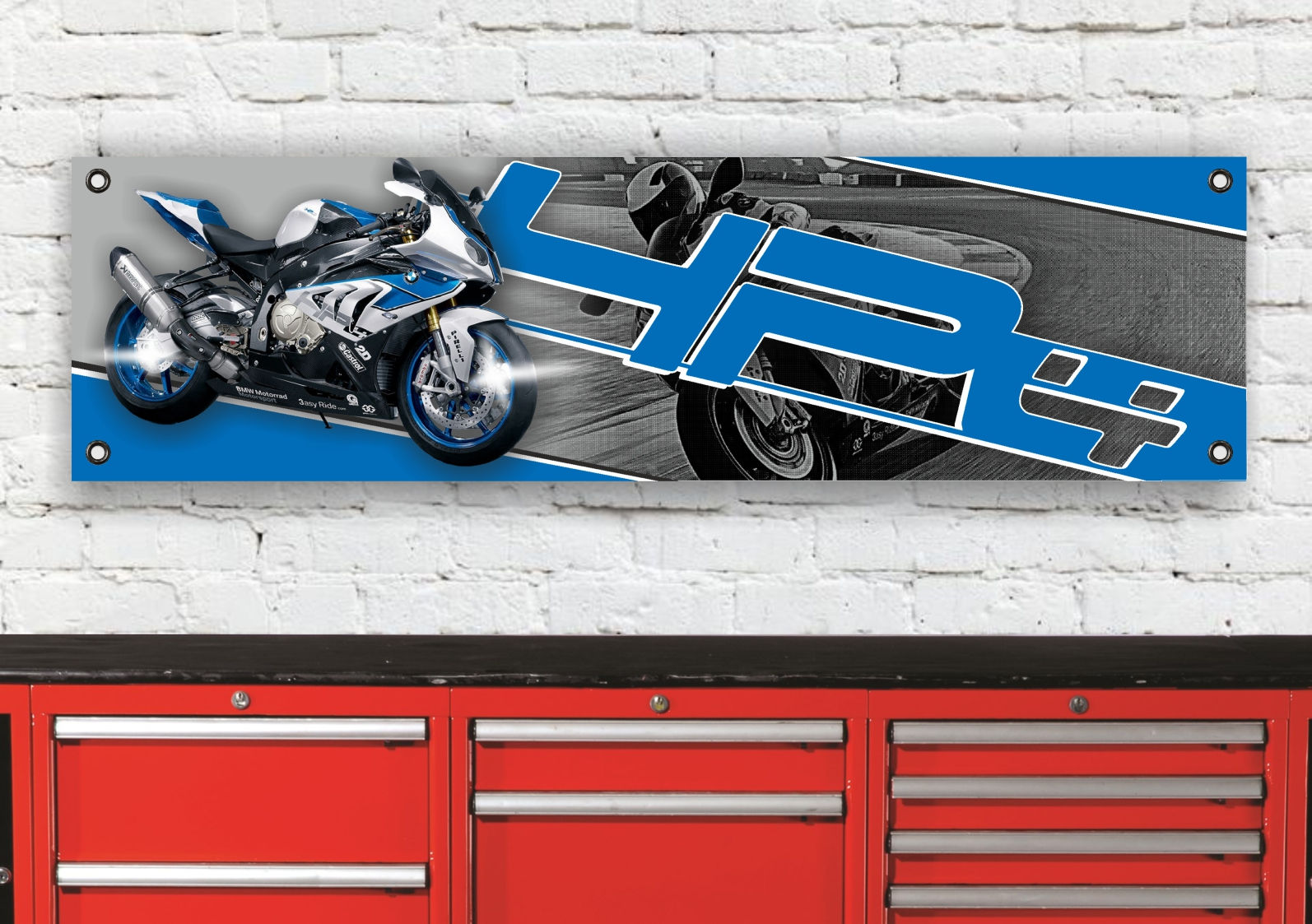 Blue and white motorcycle, YRC logo, racing action, and red toolbox background.