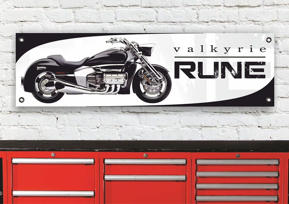 Valkyrie Rune motorcycle sign on a white wall above a red toolbox.