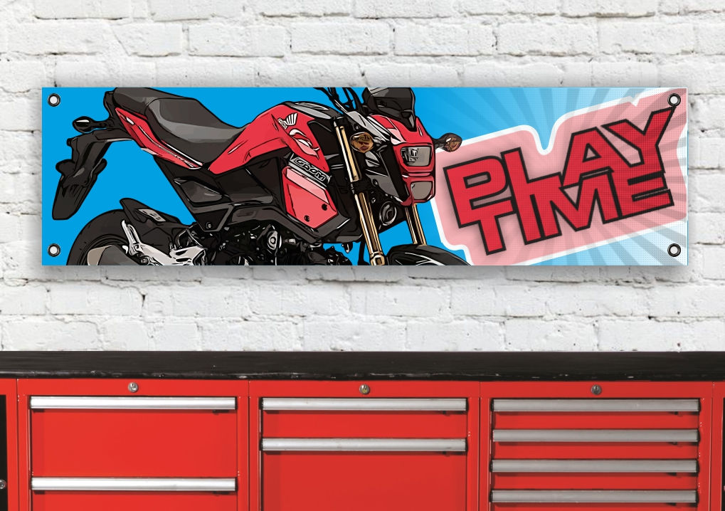 Motorcycle banner with "PLAY TIME" lettering hanging above a red toolbox.