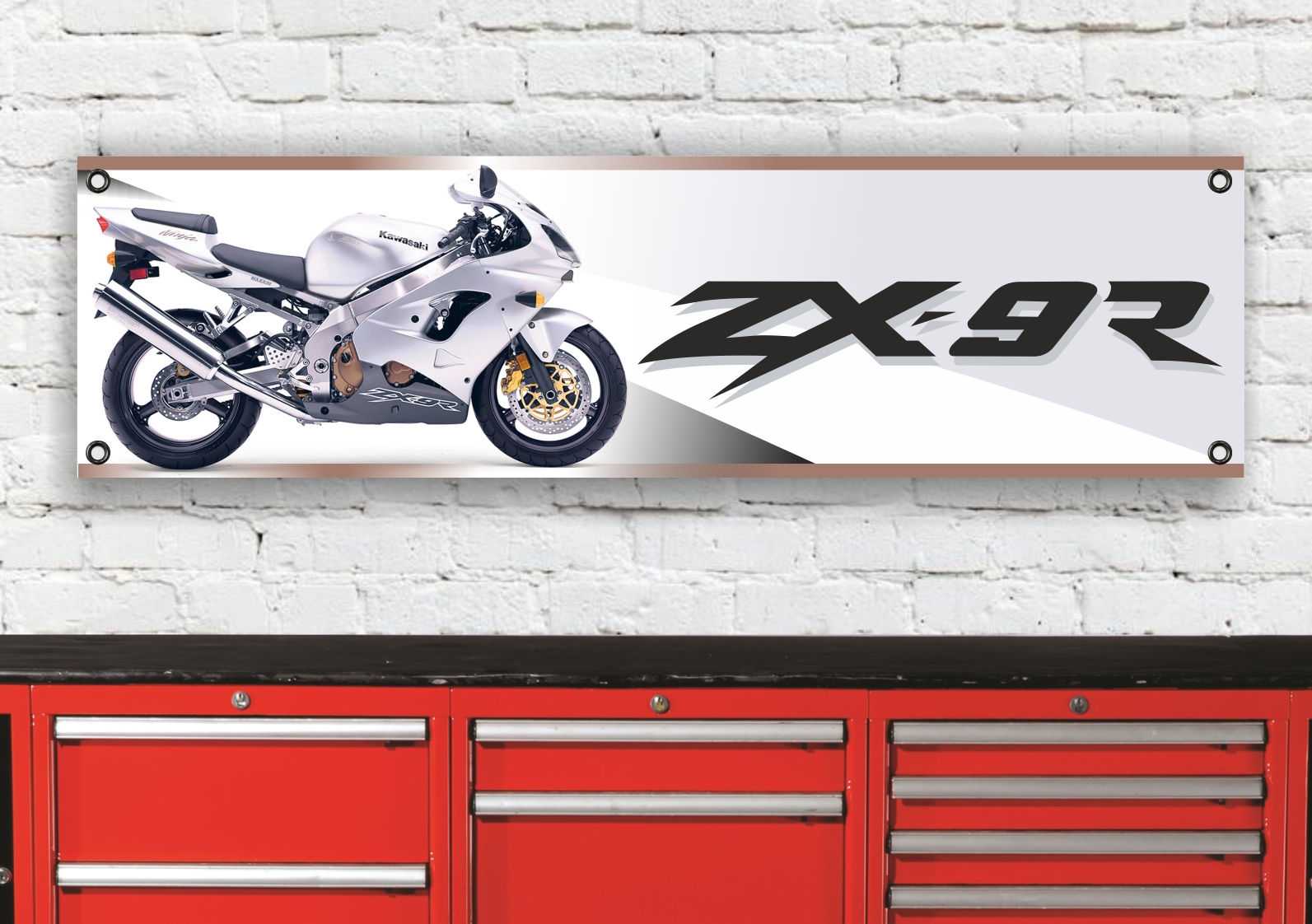 White ZX-9R bike with ZX-9R SILVER text on a white banner, over drawers