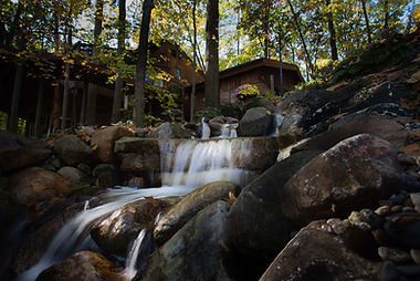 backyard water feature with natural stone landscaping