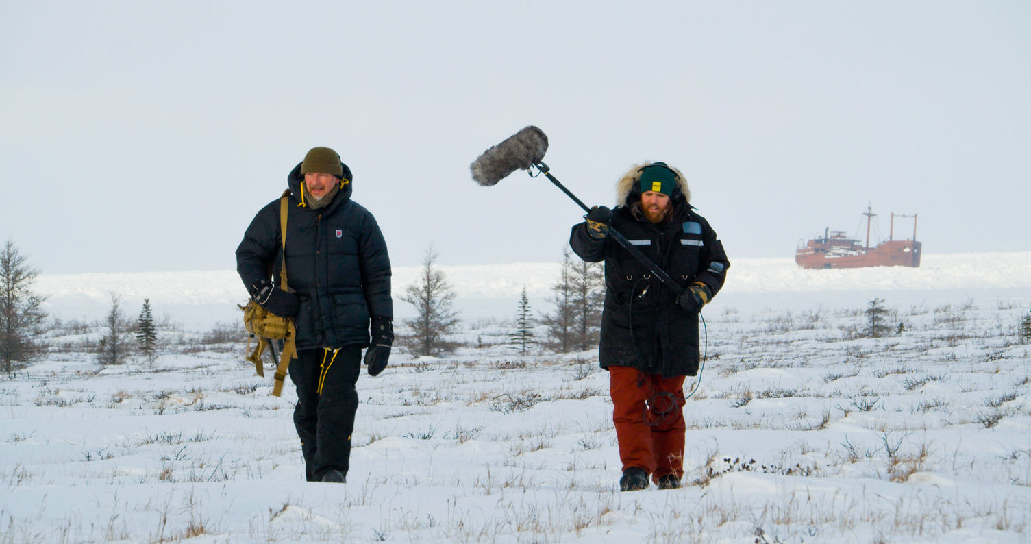 Chris Morgan and Matt Martin on snowy field near Hudson Bay during production of polar bears episodes for THE WILD with Chris Morgan podcast