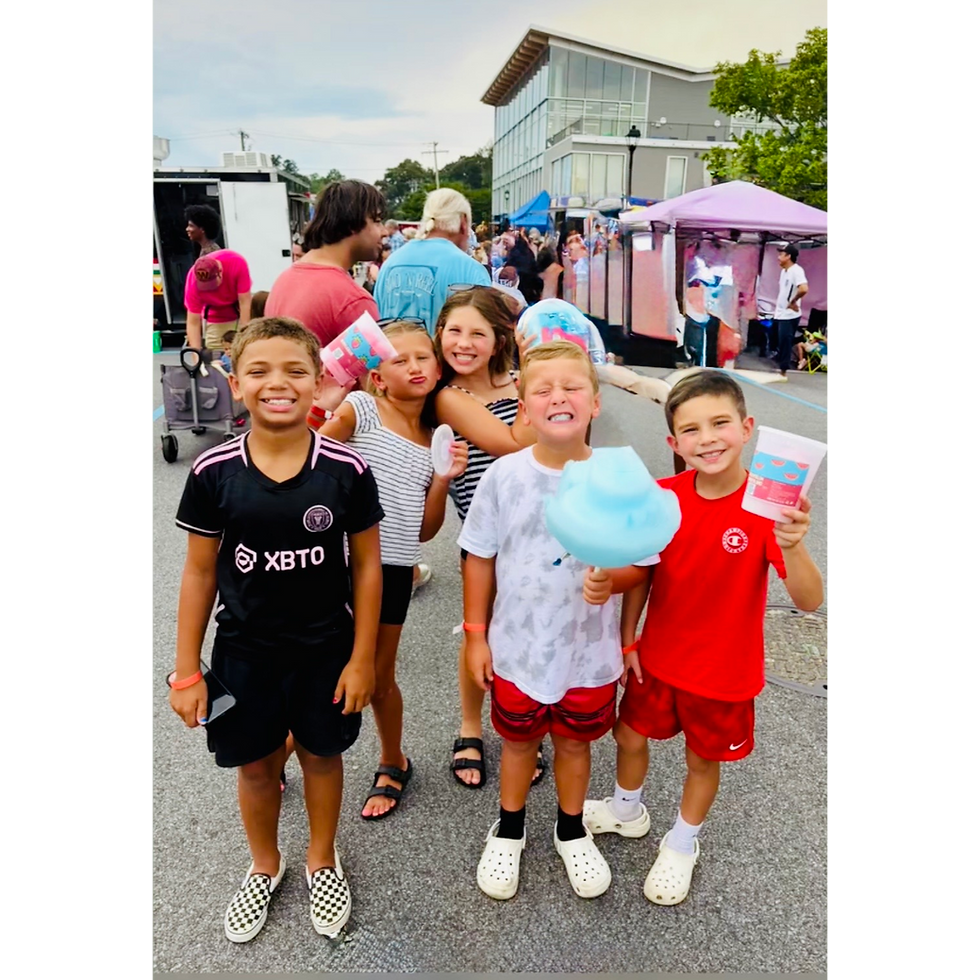 Children holding cotton candy, corporate event entertainment ideas.