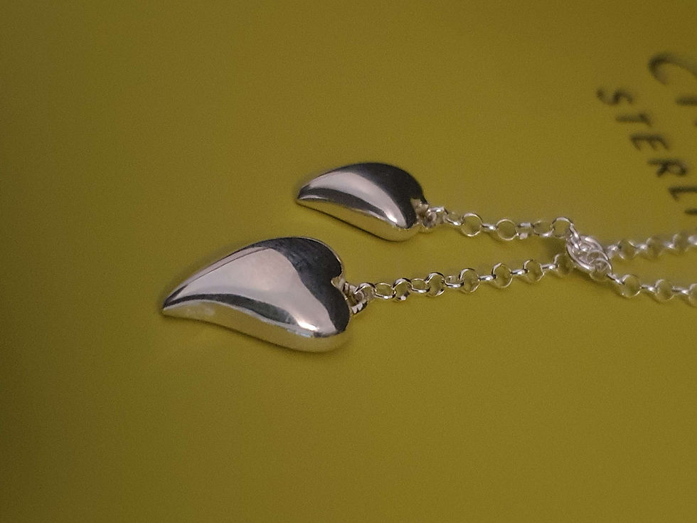 Thumbnail: Polished Pebble Double Heart Pendant