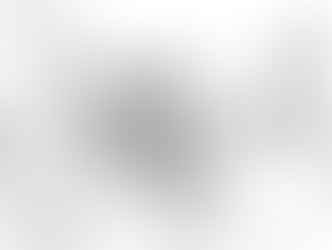 A scene from Route Irish in which the protagonist sits amid rubble.