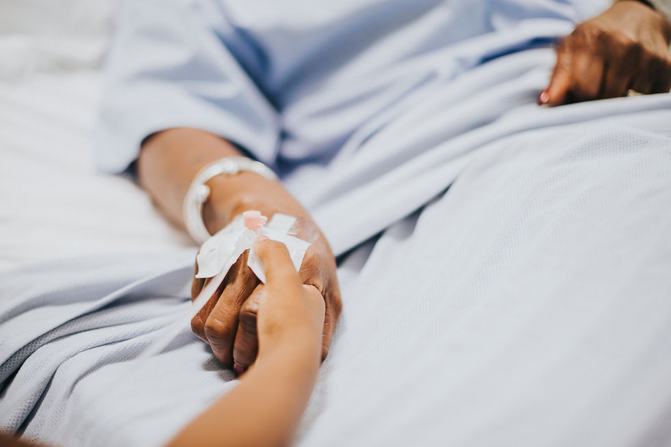 daughter-holding-her-mothers-hand-hospital.jpg