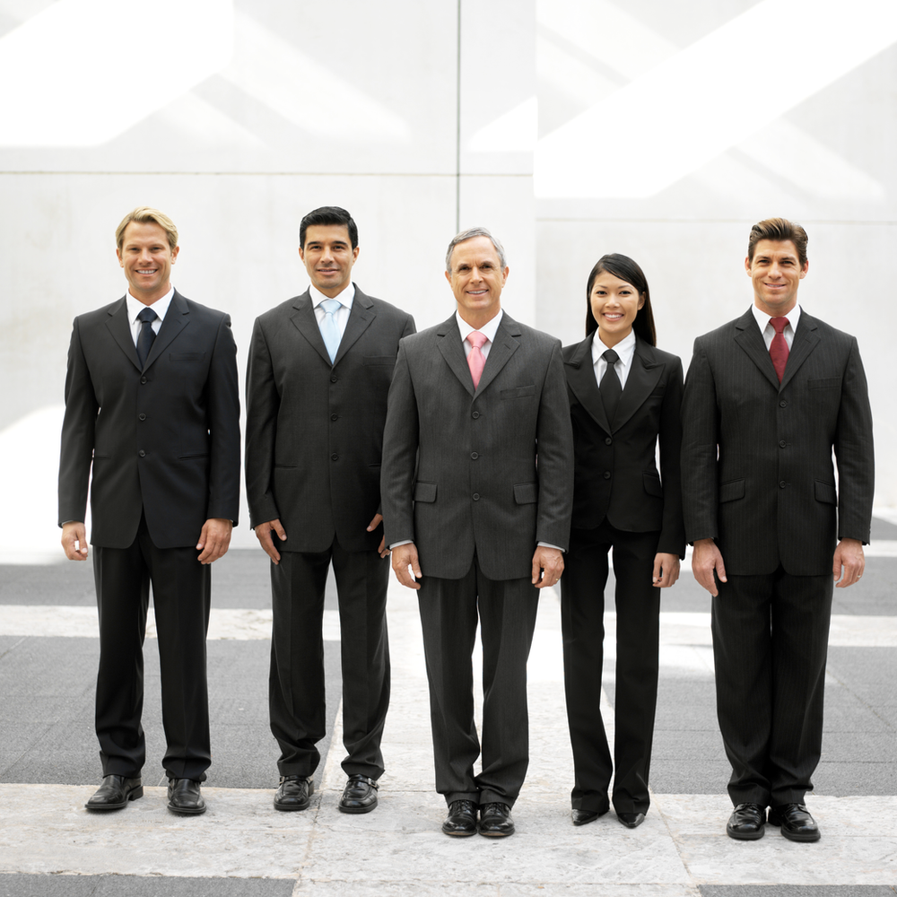Group of 5 office workers wearing suits