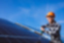 man-worker-firld-by-solar-panels.jpg