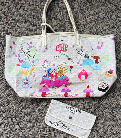Hand-painted Goyard bag featuring original whimsical illustrations, fairy-inspired artwork, colorful fantasy details, and personalized elements unique to the owner. Custom luxury designer bag transformed into wearable art with playful hand-drawn characters and dreamy aesthetics.