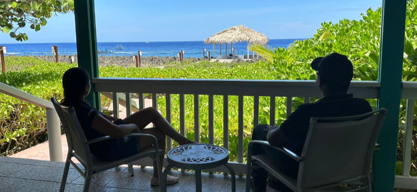 Guests enjoying the view from their Seagrape bungalow.