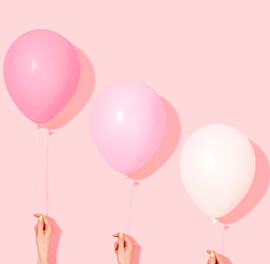 Hands Holding Balloons