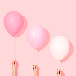 Hands Holding Balloons