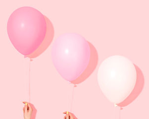Hands Holding Balloons