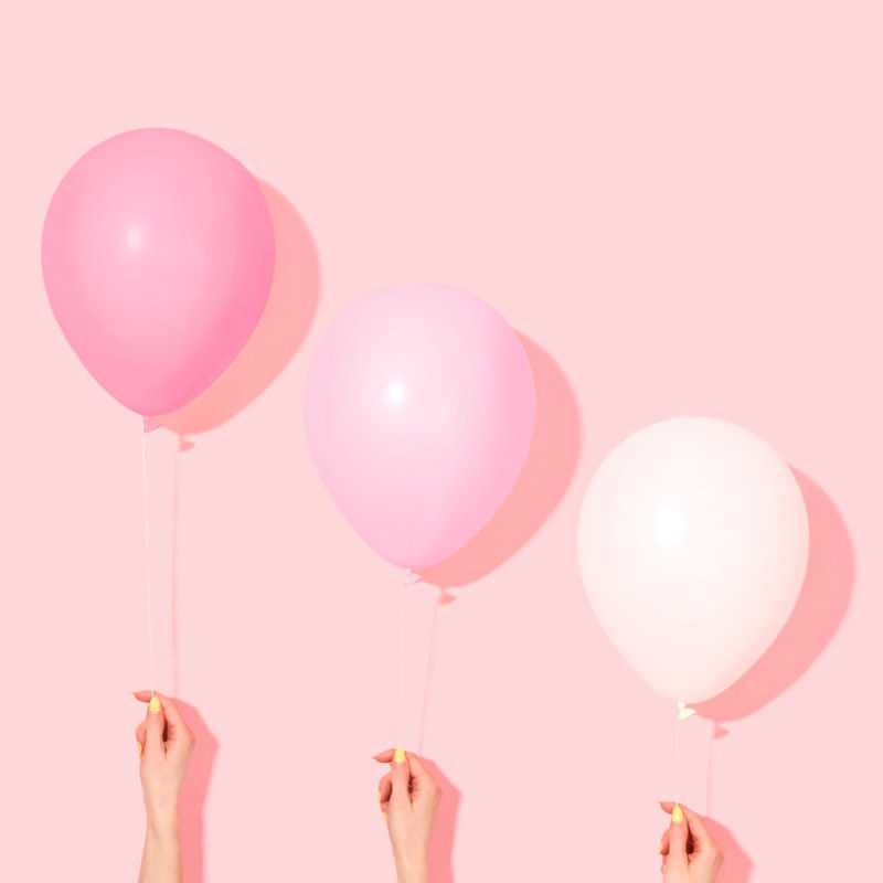 Hands Holding Balloons
