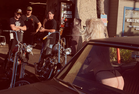 woman-flirting-with-men-motorcycle-chopper-fashion-editorial.jpg