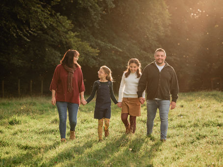 Family walking together during a relaxed outdoor photoshoot in Somerset