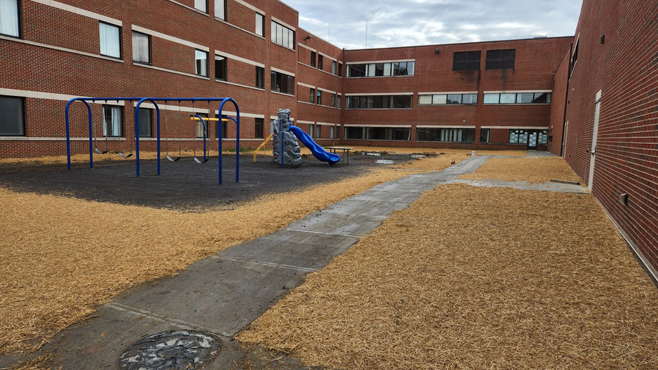 The grounds within large school buildings is prepped and ready to by hydroseeded