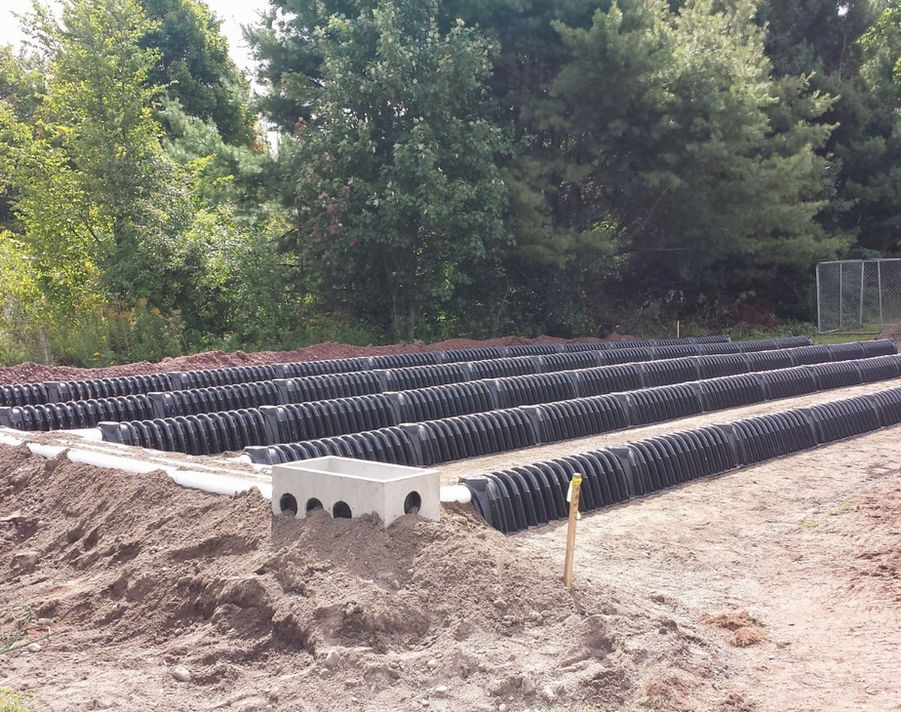 A leach field septic system in the dirt ground