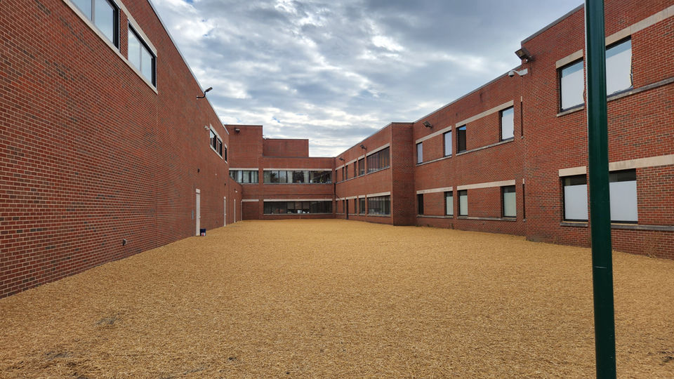 The grounds within large school buildings is prepped and ready to by hydroseeded