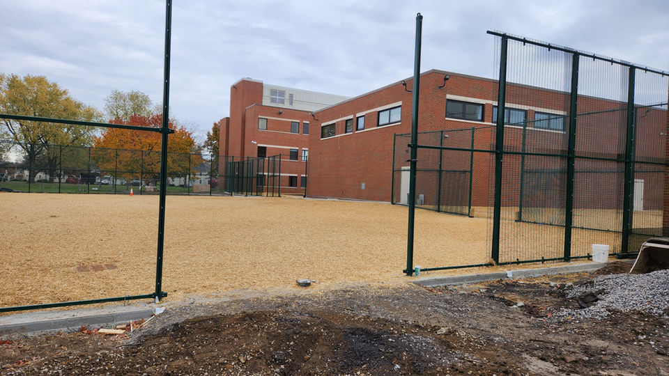 The grounds within large school buildings is prepped and ready to by hydroseeded