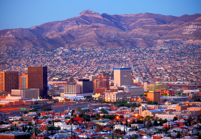 Cityscape with mountains at sunset