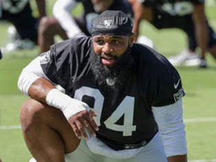 NFL Player Chris Wilkins Fired by Las Vegas Raiders After Kissing Another Player