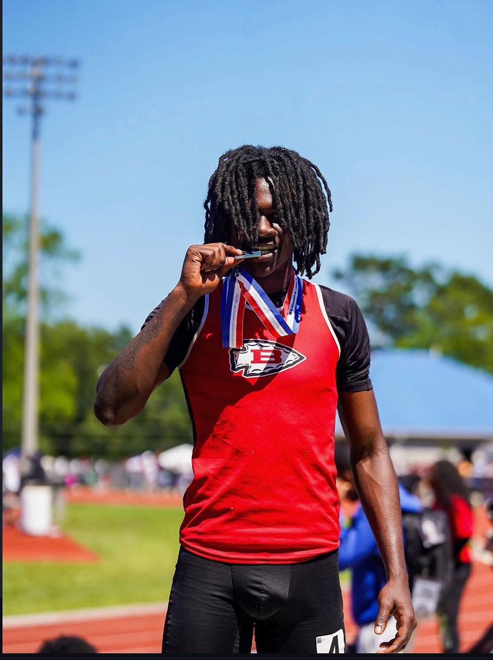Photo: Brelyn Tucker being awarded runner-up medal for placing 2nd at the MHSAA State Championship.