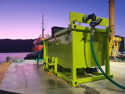 Condor's pH Correction Unit next to the water with the sun setting