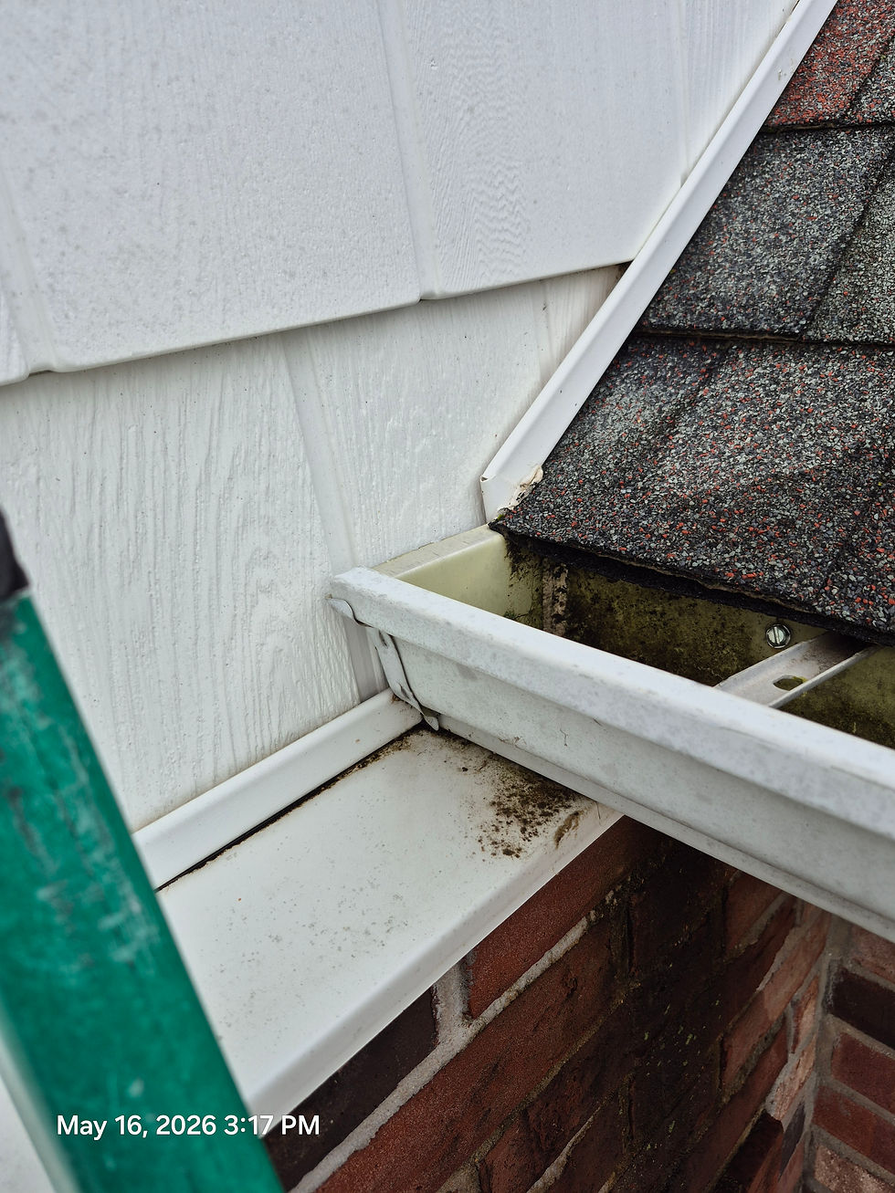 Photo: Where the kickout flashing should have been, notice how the gutter terminates directly against the siding.