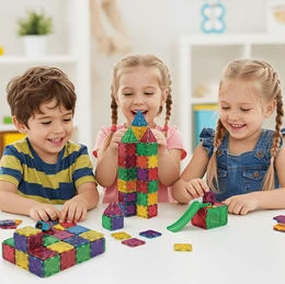 younger kids playing with magna tiles in a group
