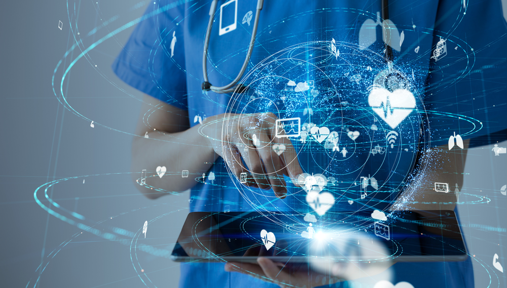 healthcare worker with lots of cyber devices