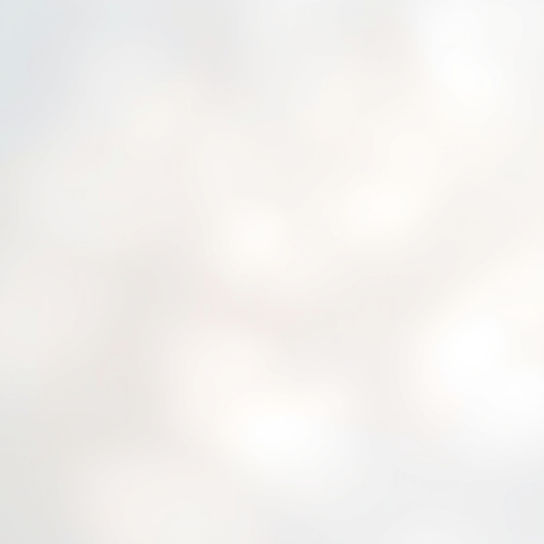 Very soft and light blurry abstract background image with no subjects in warm whites and l