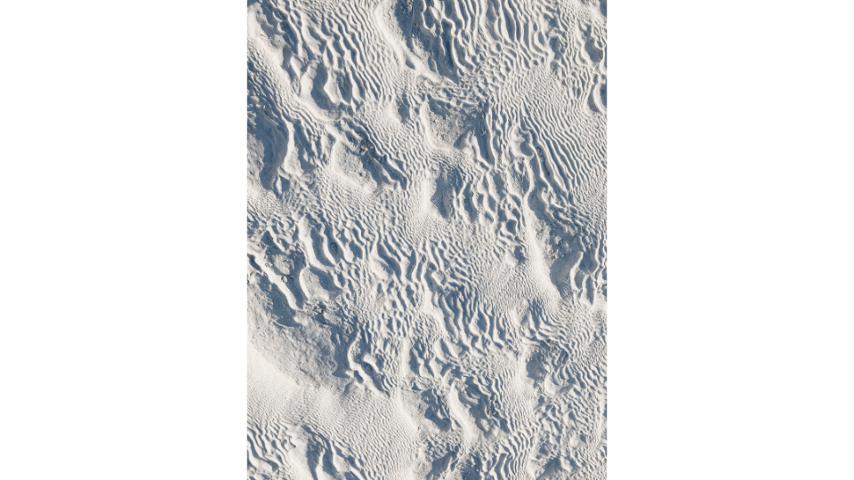 Tourist walking on the white travertine terraces of Pamukkale during a Turcome day tour from Alanya.