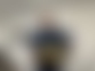 Chris with ATK cake to celebrate 10years of business