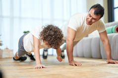 Father and son exercising together