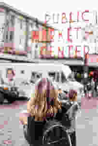 Woman taking picture of market
