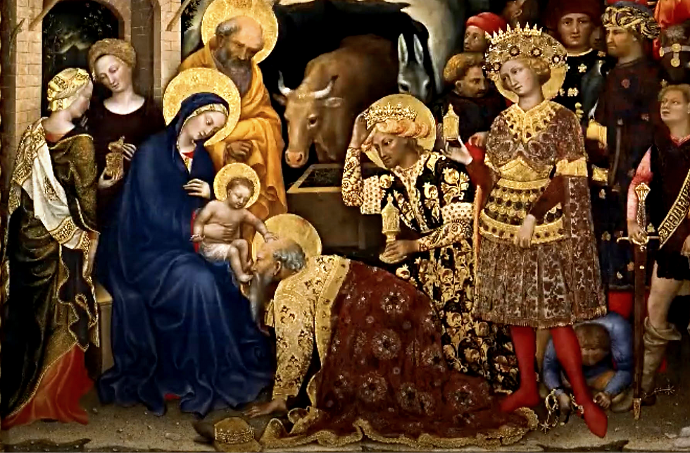 Ornate scene of figures in colorful robes at a nativiåty, with gold accents; animals and an entourage in the background. Religious mood.