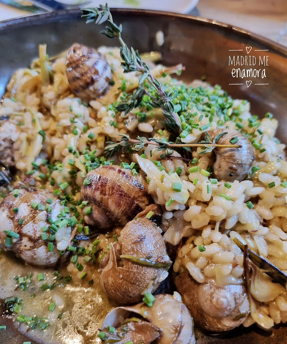 Arroz de alcachofas y caracoles a la llama.